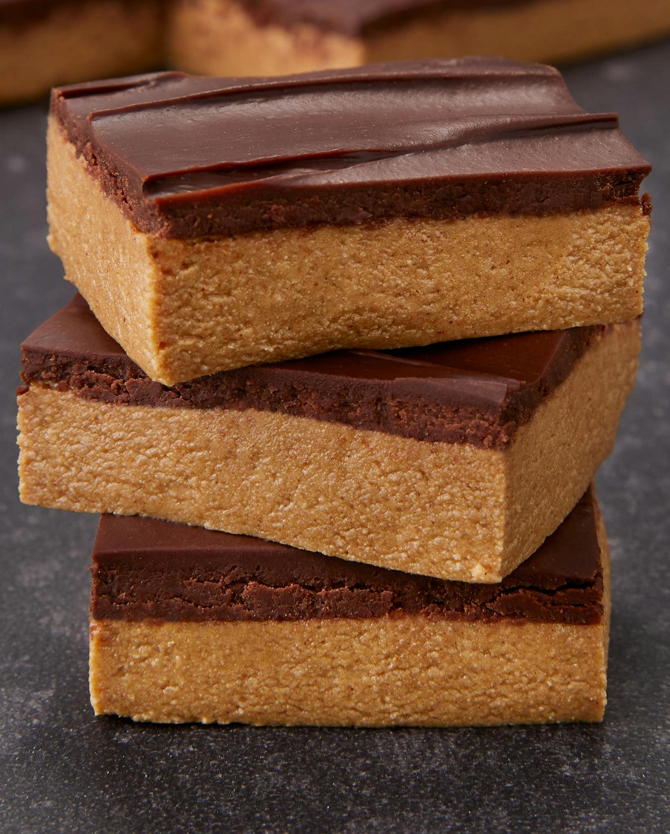 A stack of peanut butter brownies made with Dymatize Whey protein powder.