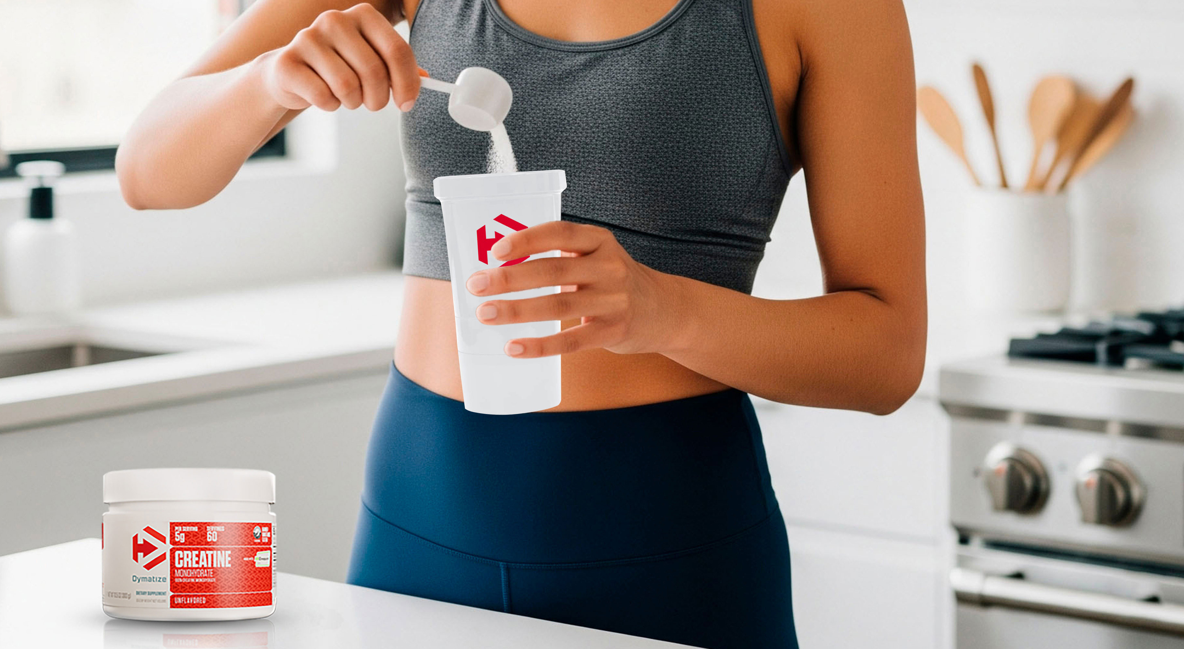 A woman mixing Dymatize Creatine into a Dymatize shaker cup.